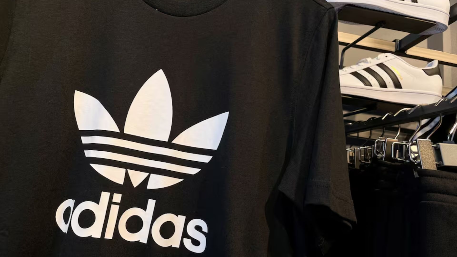 Adidas posts first loss in 30 years and warns on US